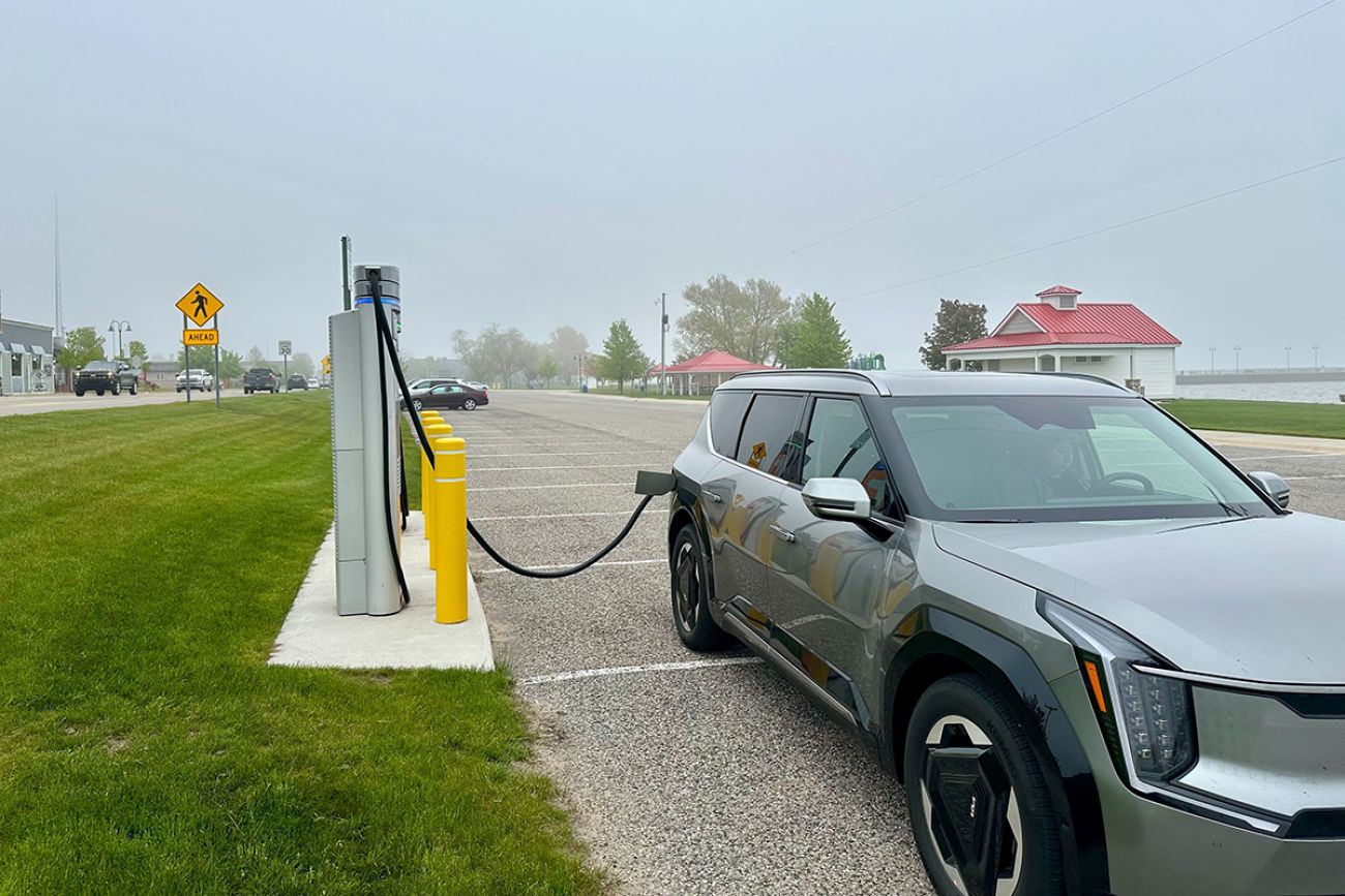 A grey car being charged