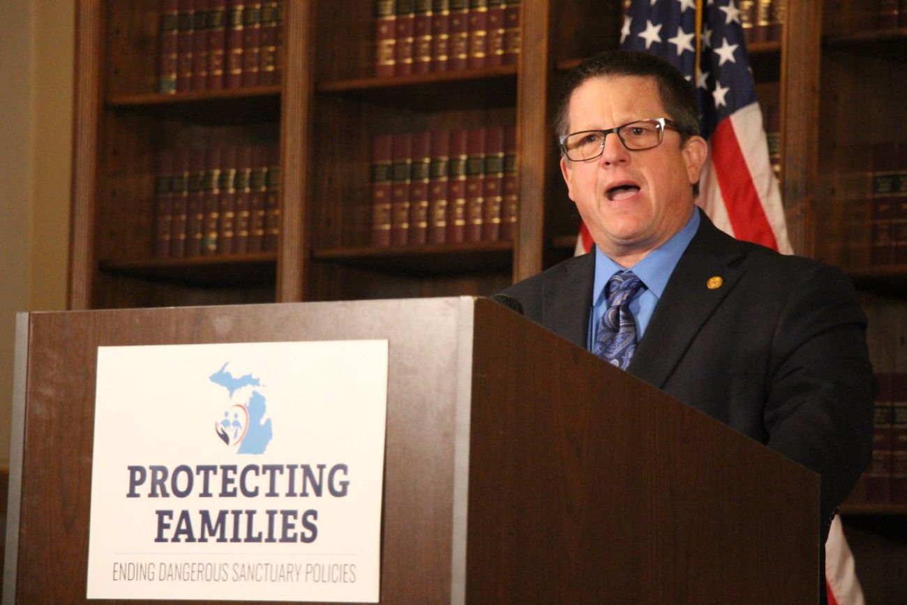 State Rep. Brian BeGole speaks at a podium