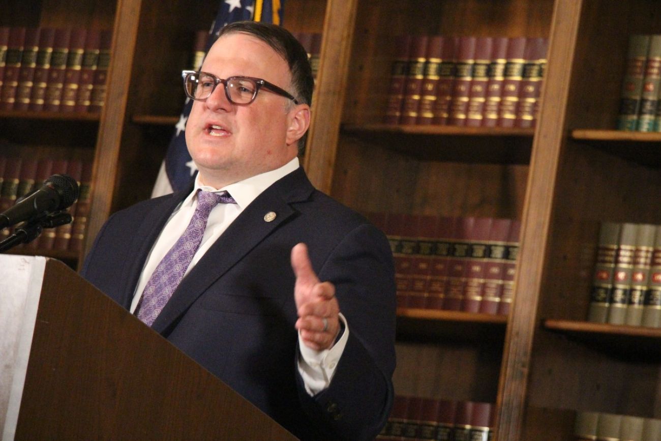 Michigan state House Speaker Matt Hall speaks at a podium